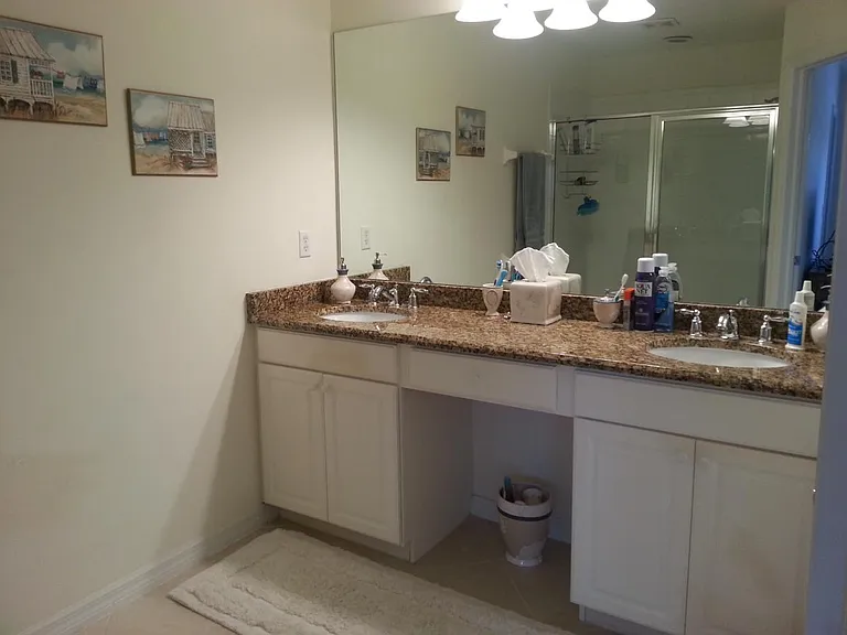 Bathroom with granite counters and upgraded fixtures