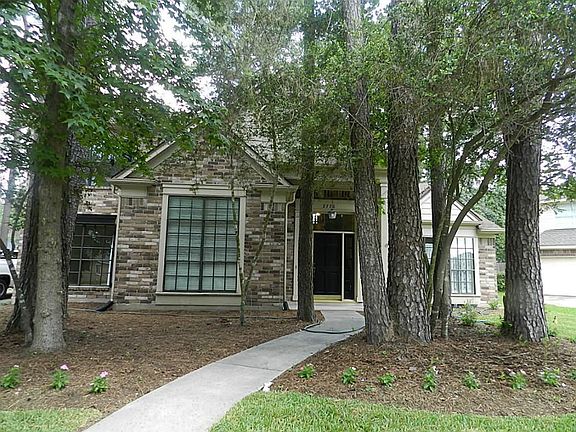 Recently planted grass in front plush plenty of beds with fresh Mulch!