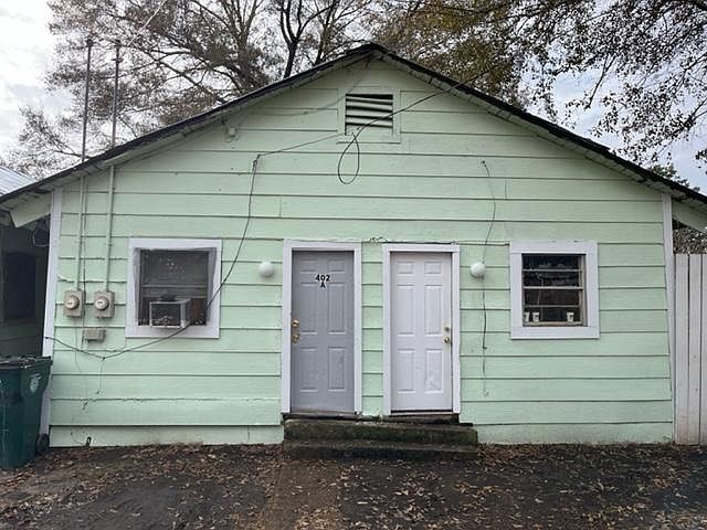 Front of Building

Planning to paint sooner than later
it won't be green long
doors will be same color