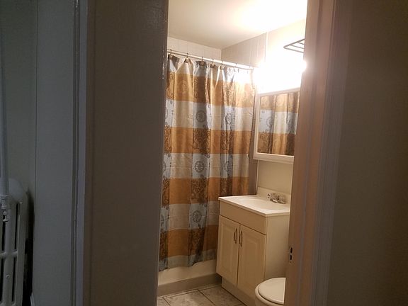 Bathroom with partial view of the dining room.