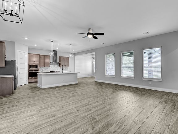 Open-concept layout that allows easy transition from cooking to dinner to movie night.