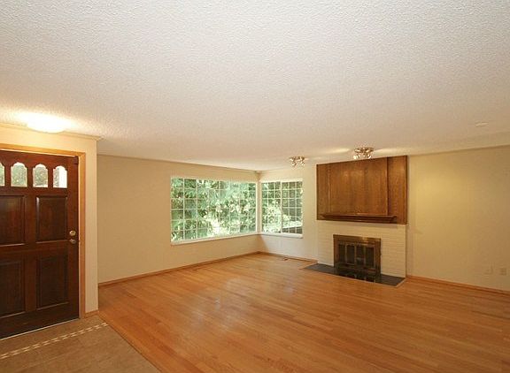 Welcome inside! A ceramic tile entryway leads beside the living