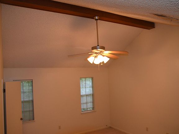 Master Bedroom with cathedral ceiling. Walk in closet is behind you. Bathroom is to the left.