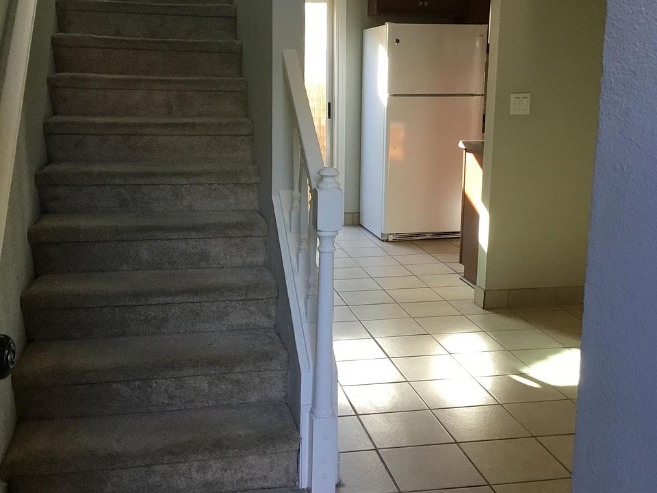 Entry. Loft, bedroom and bath are upstairs. Living room to the right. Kitchen and private patio straight ahead.