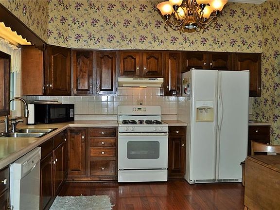 Large eat-in kitchen offering plenty of storage space.