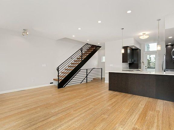 Living Room facing east to kitchen and back deck