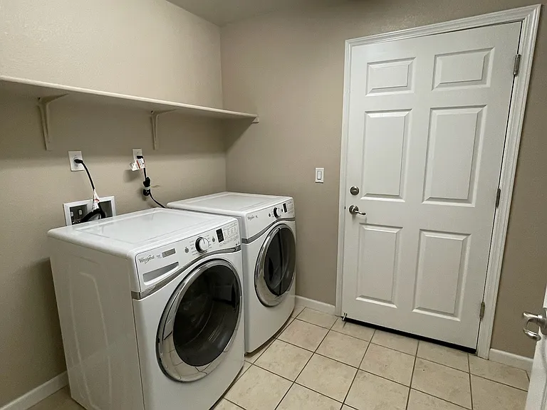 Garage entrance and Washer/Dryer set