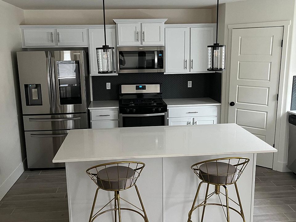 Large kitchen with brand new appliances and kitchen island