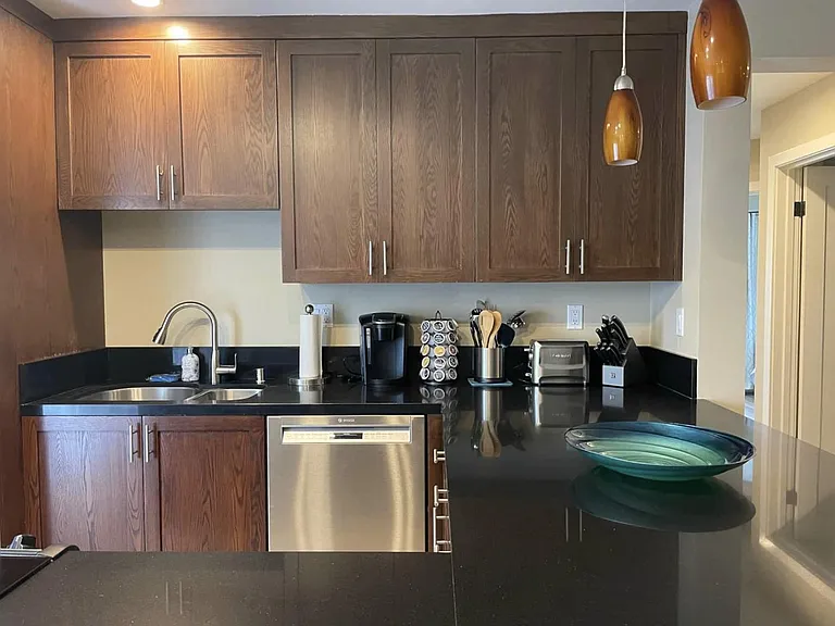 The small appliances include a premium coffee maker and coffee pods