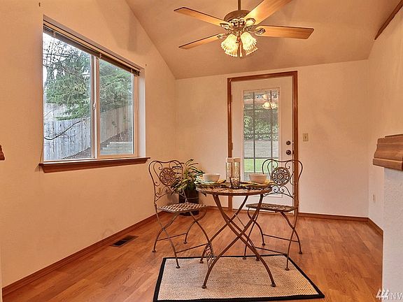 The dining area overlooks the completely fenced in backyard.