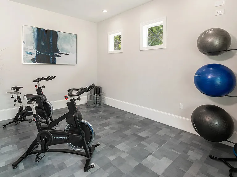 Our fitness center also features a spin studio. Whether you're crushing a spin session or winding down with a stretch, this sleek wellness space supports your every move.