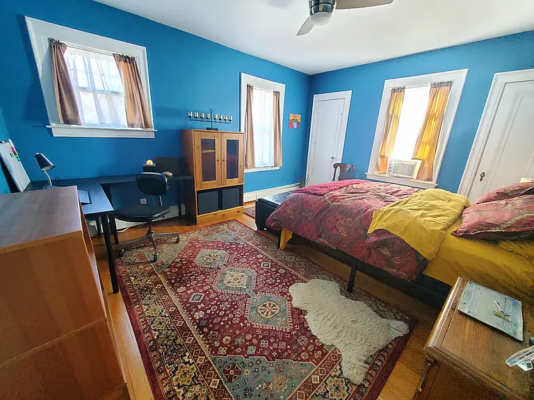 This large sunny room has two closets, a desk, bookcase, and nightstand. Sheets are provided.
