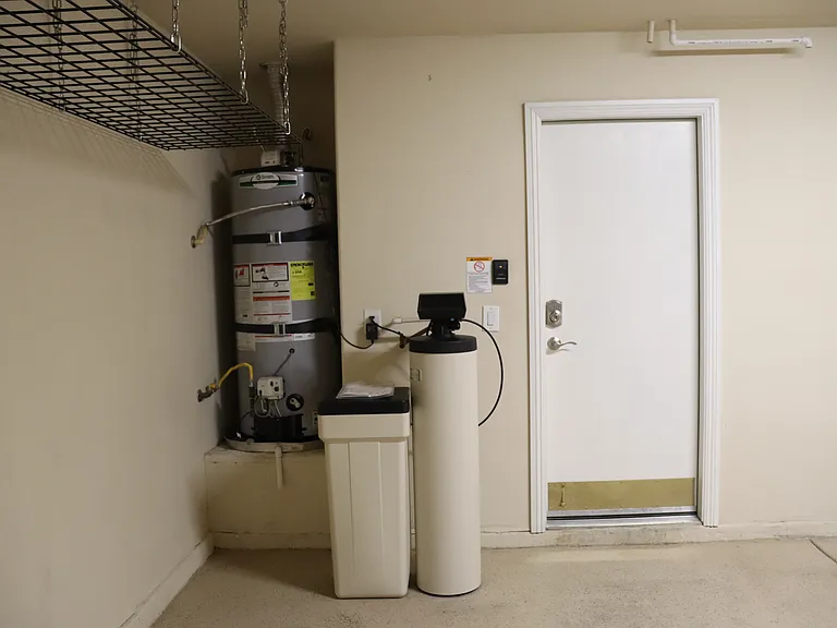GARAGE WITH WATER SOFTENER SYSTEM AND OVER HEAD STORAGE