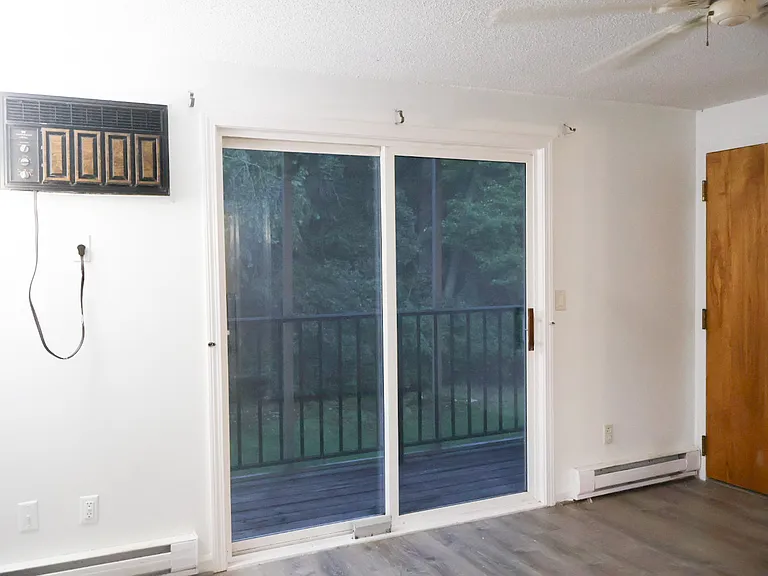 Living Room / Living Space _ Renovations Nearing Completion. New Baseboards Will Be Installed and the Fire Escape Door Will Be Freshly Painted.