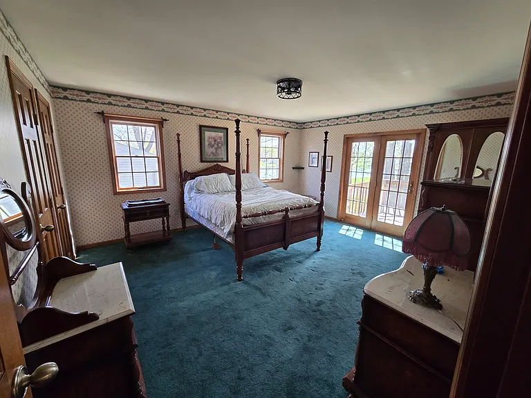 Master bedroom on first floor with rear deck access
