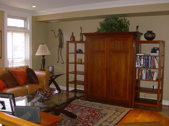 Living Room with hardwood floors, crown moldings and recessed lites