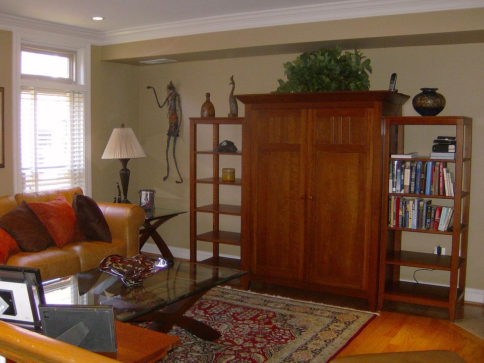 Living Room with hardwood floors, crown moldings and recessed lites