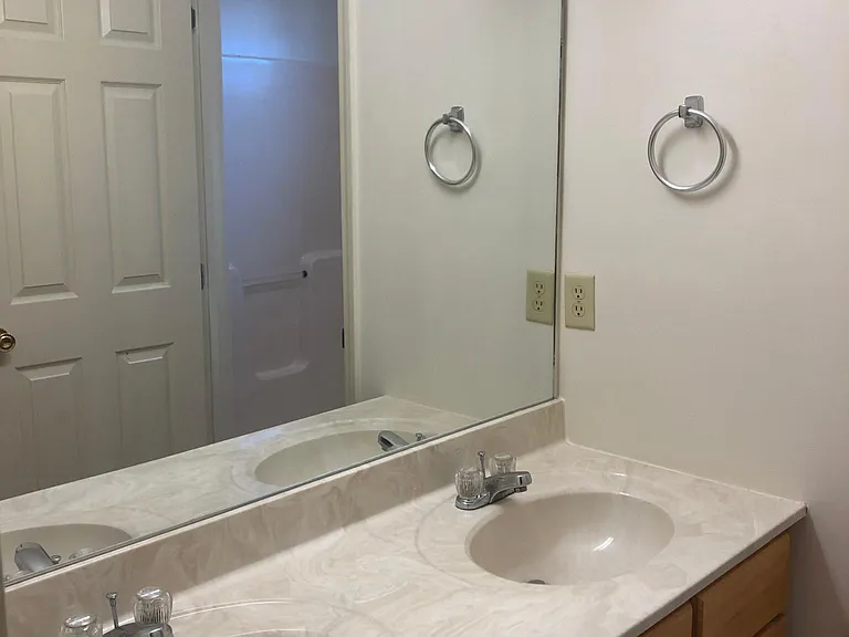 full bath w double sink and bath shower combo on second floor.