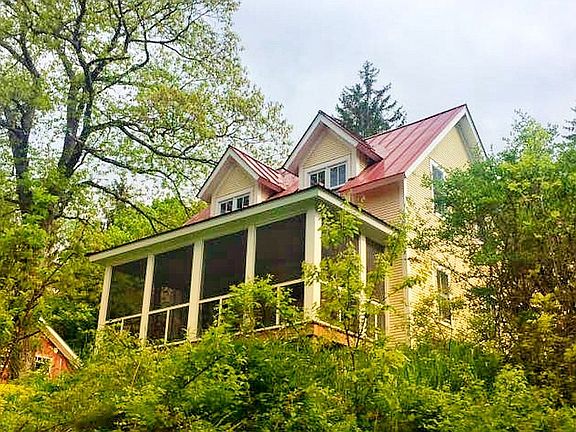 Screened porch view of the farmhouse