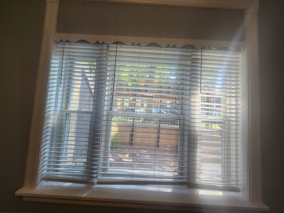 Big windows offer natural light and offers view to front garden.