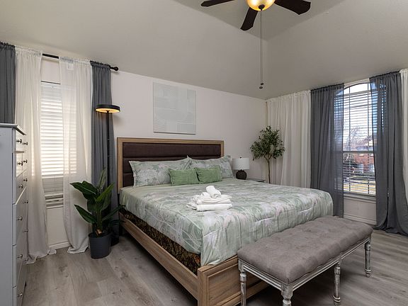 Cozy bedroom with a king bed and nature-inspired decor.
