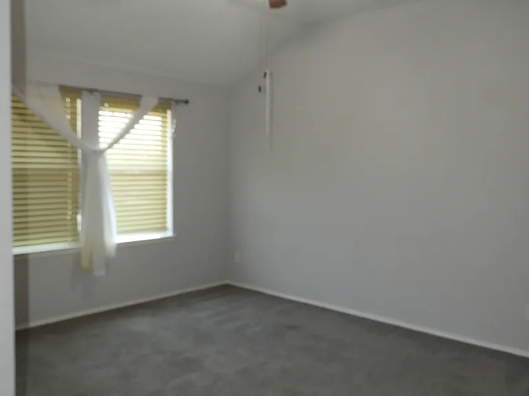 Bedroom #4 with ceiling fan.