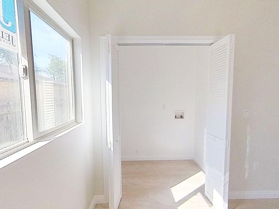 Washer and dryer hook-ups located in the living area with bi-folding doors to conceal the laundry area out of sight.