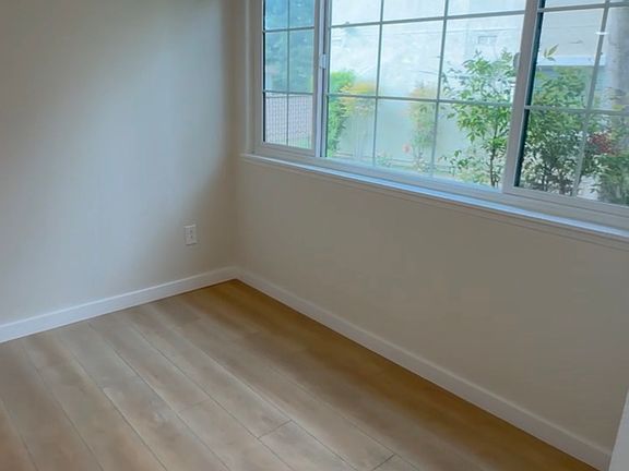 Living area window overlooking landscape area