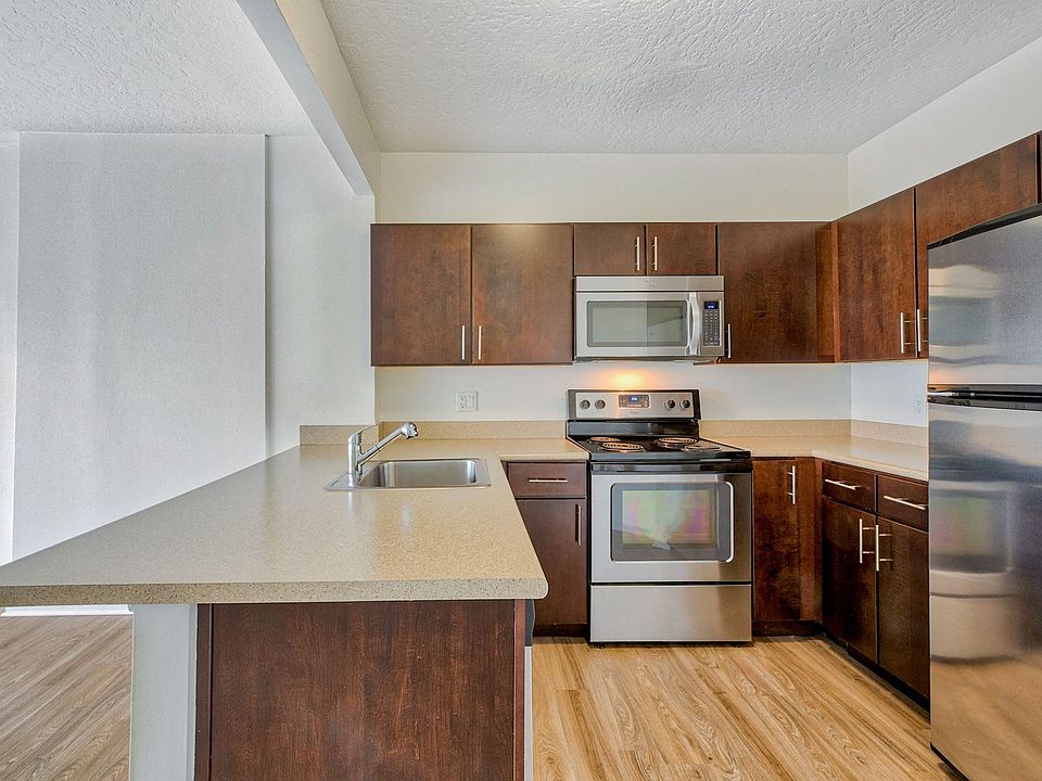 Kitchens are complete with stainless steel appliances