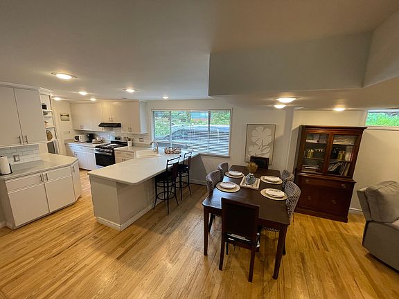 Dining and Open Kitchen Area with Breakfast Bar