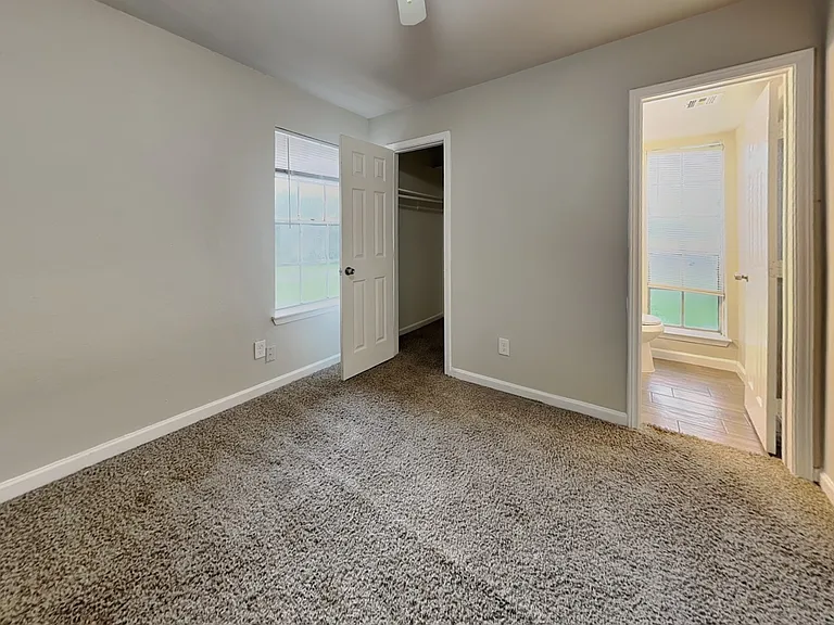 Spacious bedroom with neutral