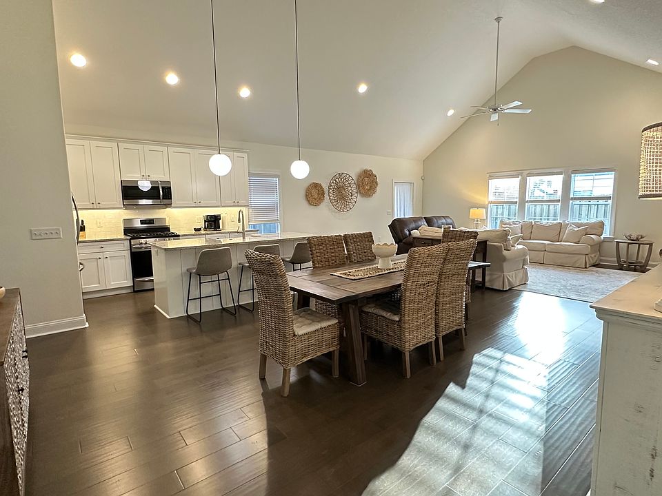 Open-concept living with vaulted ceilings and abundant natural light