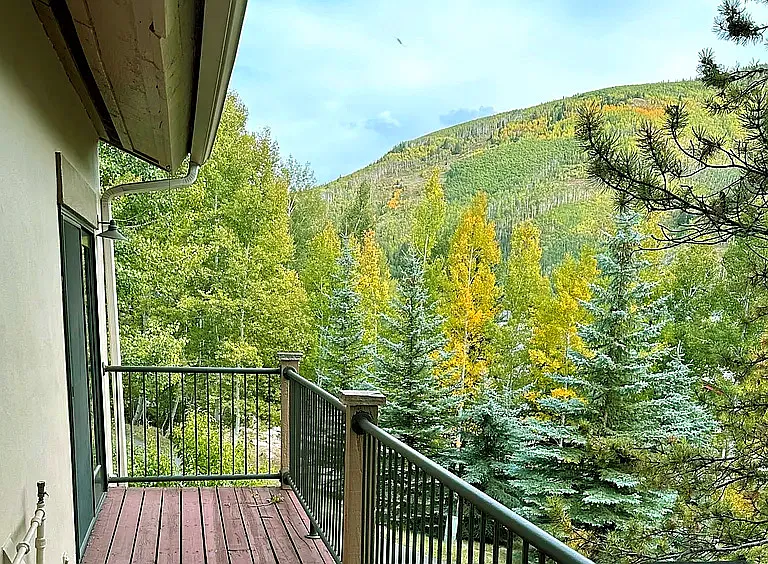 Large wrap around deck with sweeping east-west mountain views