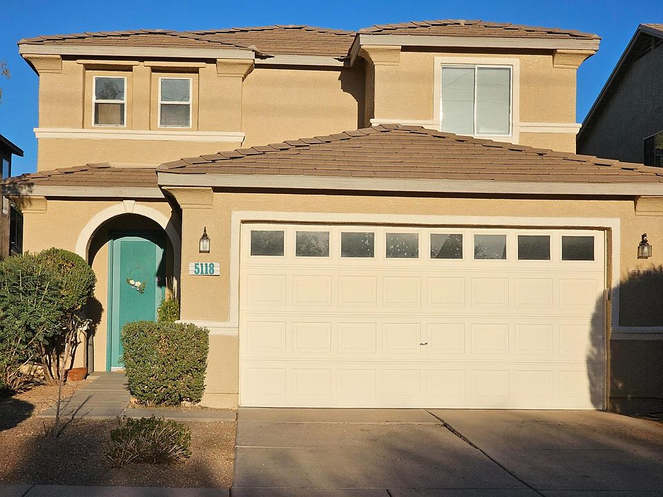 Front of House, 2 car garage, 2 car driveway.
