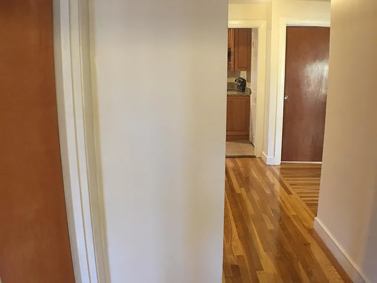 Standing in bathroom doorway facing hallway