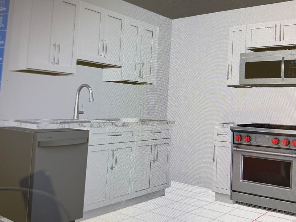 New kitchen with stainless appliances and quartz countertops under construction.