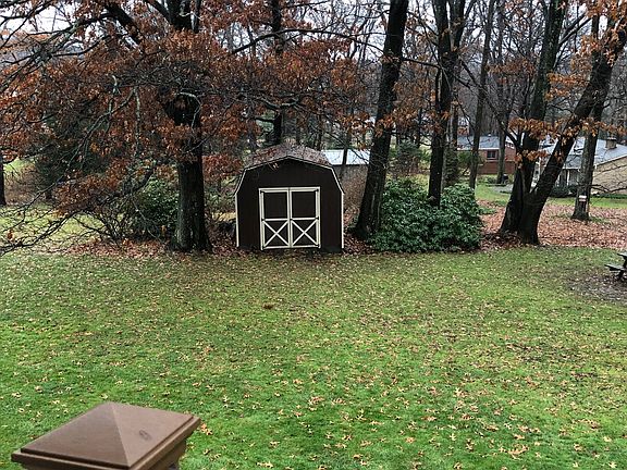 Large yard with shed.