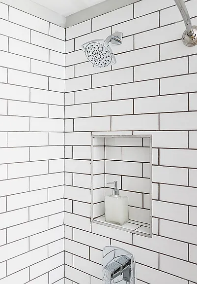 Spa-like bathrooms with rain shower head with subway tile