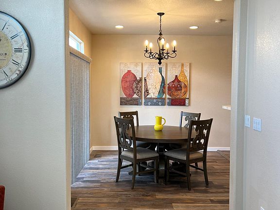 Dining with patio sliding doors directly off kitchen and living room