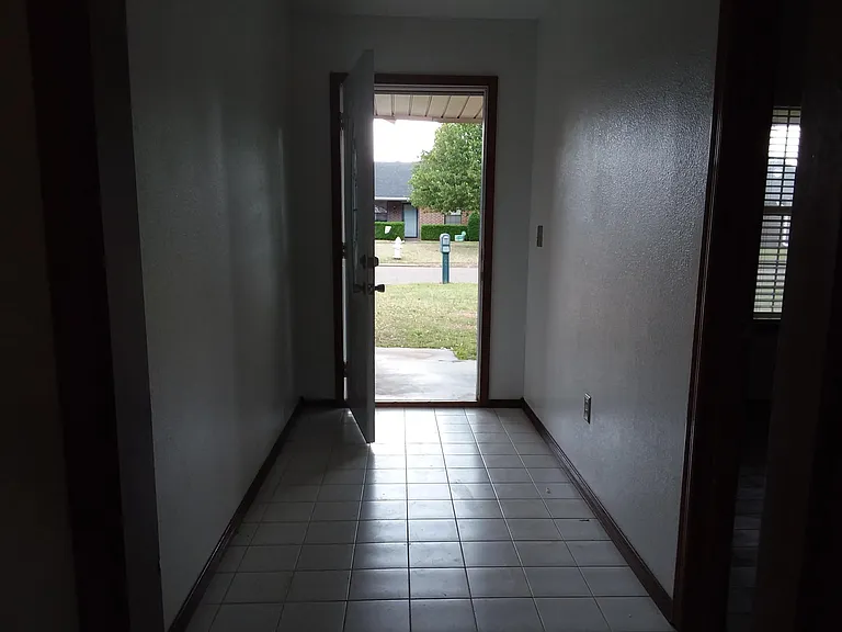 Entry way with door to 3rd bedroom/office