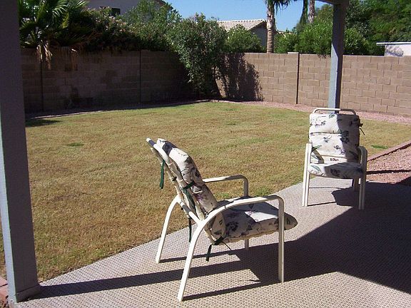 Manicured Rear Yard/Carpeted Covered Patio