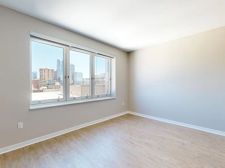 Apartment living room with wood-style flooring.