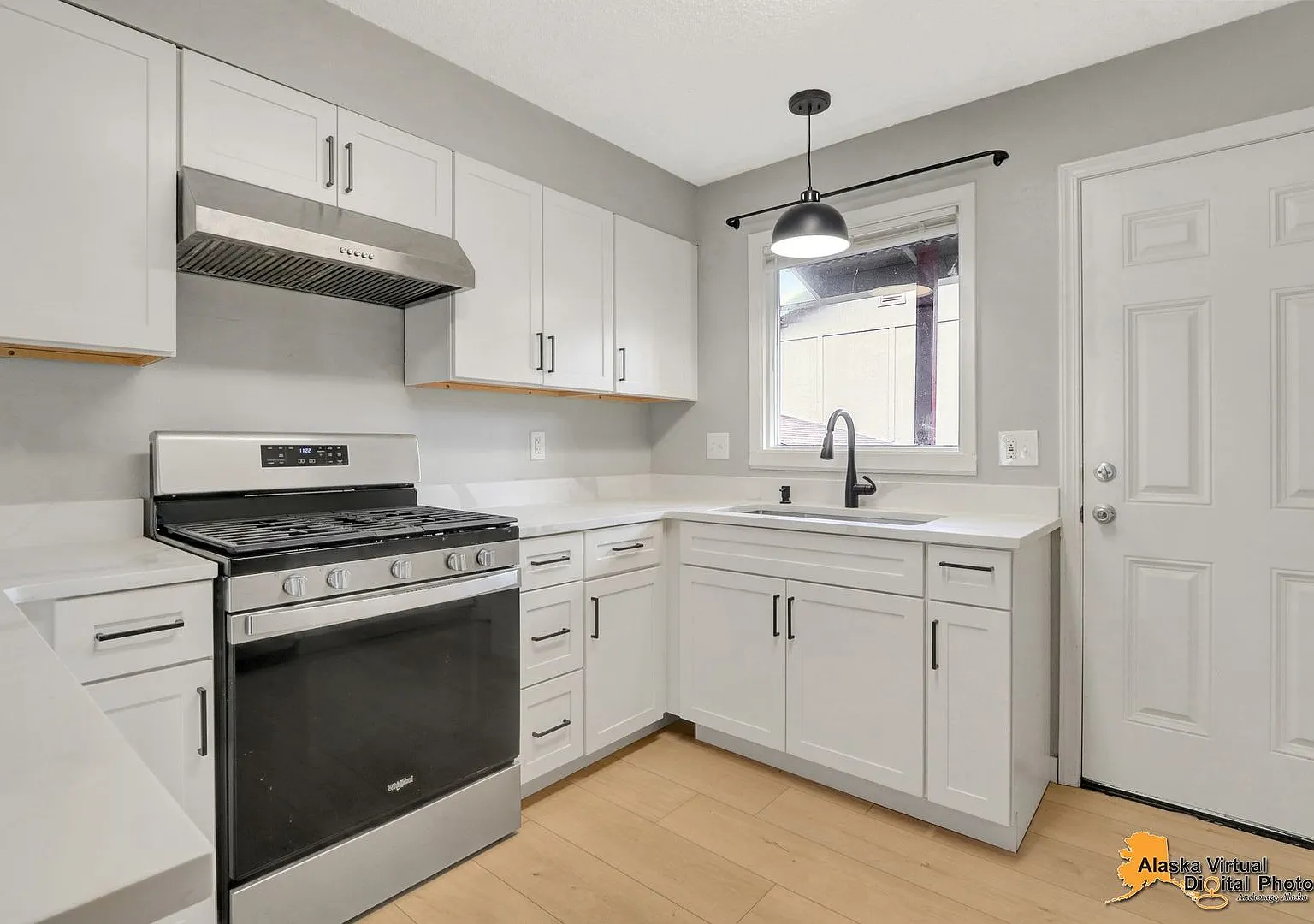 The Single-Family Alternative: 3BD/2BA Triplex Unit with Modern Comforts — Photo 1