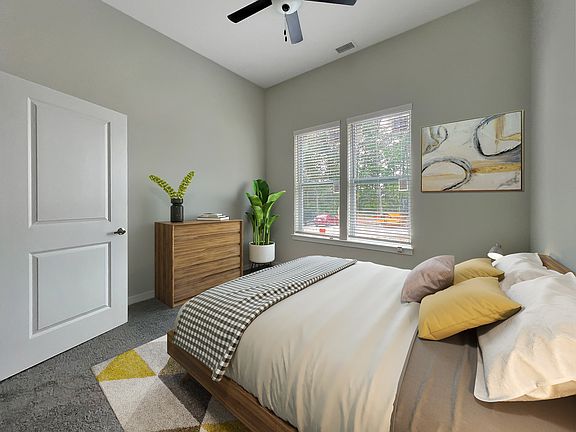 Primary bedroom with modern furniture.
