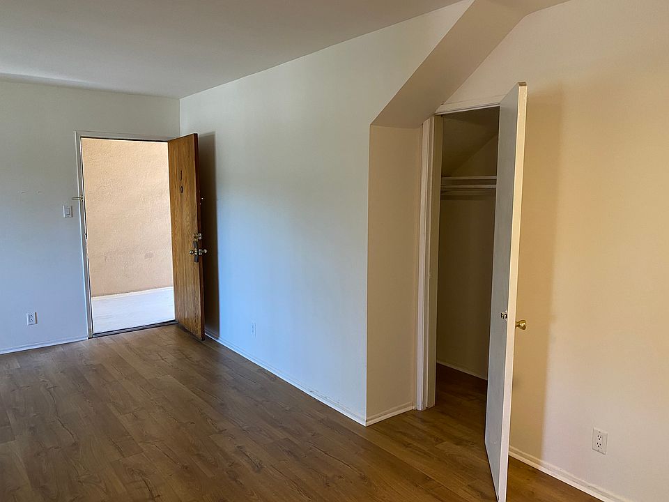 Living room and deep hallway closet for extra storage.