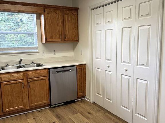 Kitchen with washer dryer hook ups behind doors