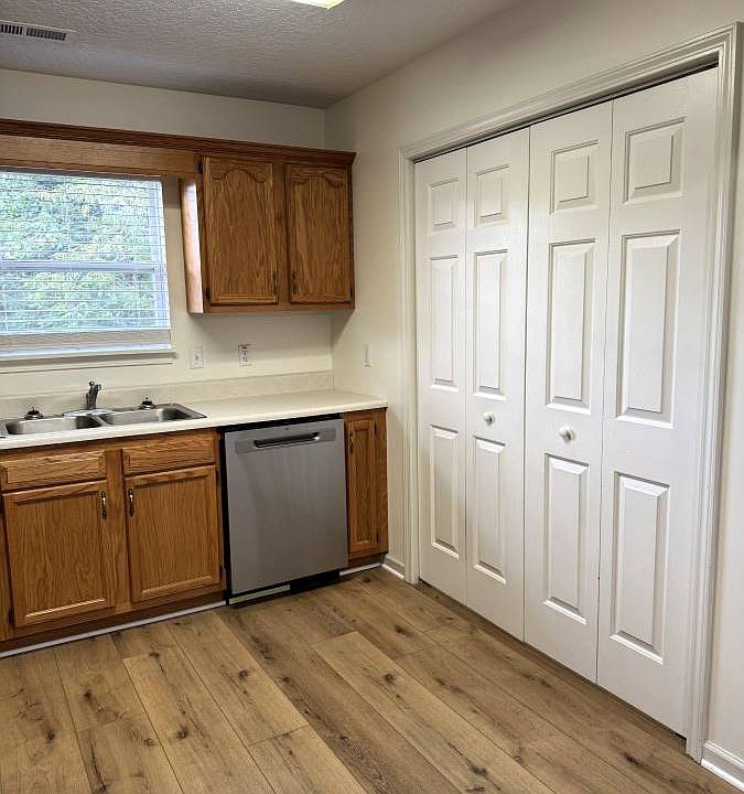 Kitchen with washer dryer hook ups behind doors