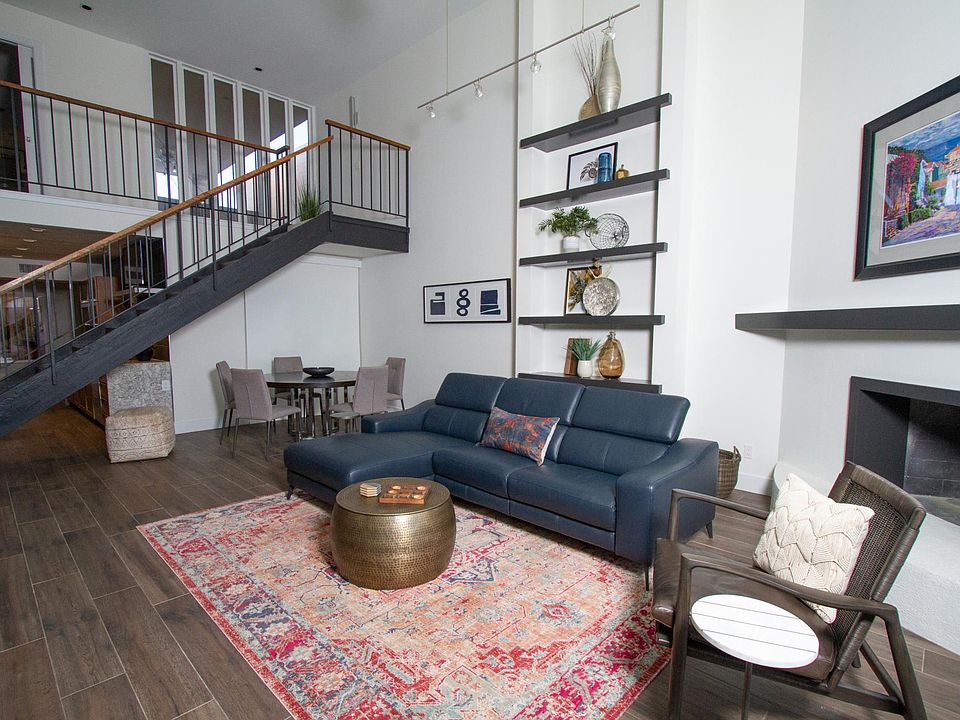 22' high ceiling with grand staircase to the second level