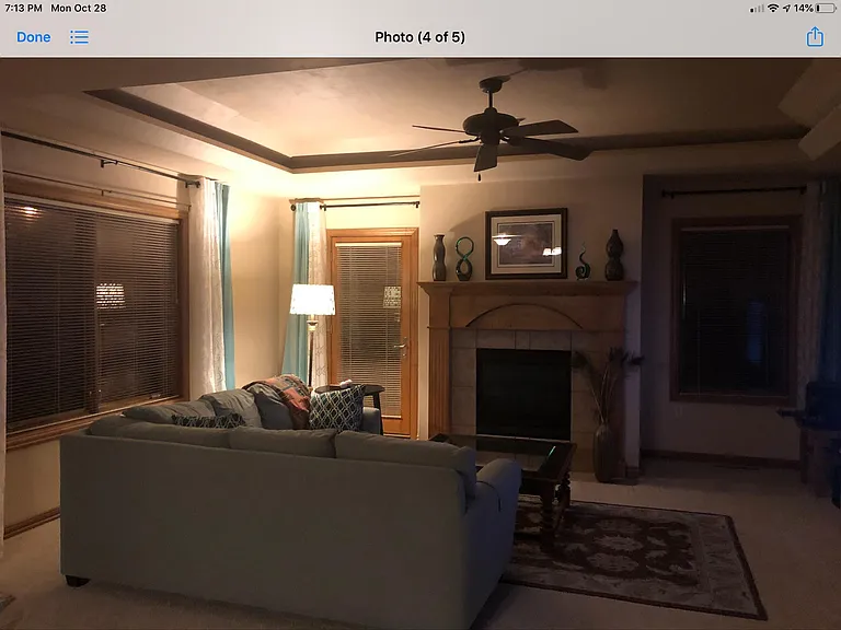 Living room with FP and tray ceiling.
