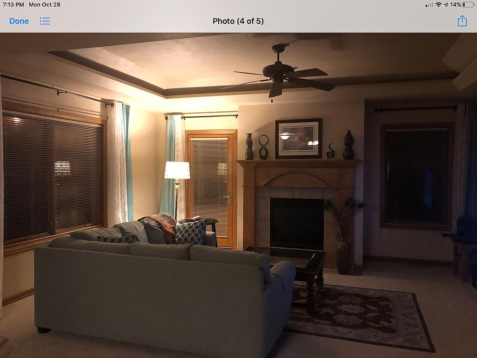 Living room with FP and tray ceiling.